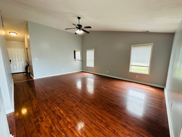 empty room with wood-type flooring, ceiling fan, and vaulted ceiling