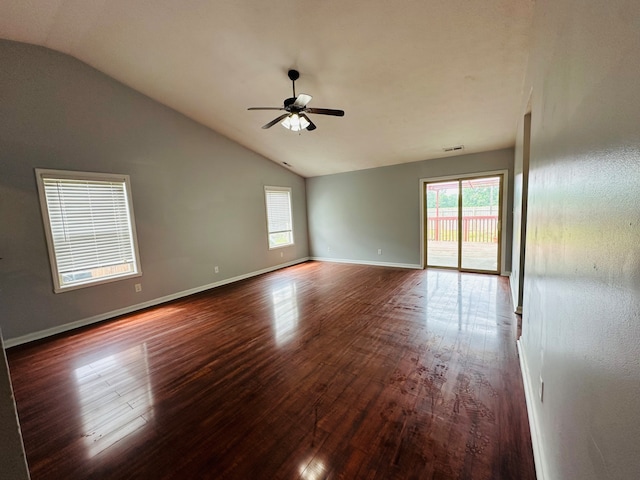 unfurnished room with ceiling fan, vaulted ceiling, and hardwood / wood-style flooring