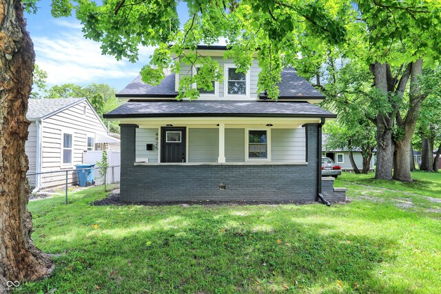 exterior space with a yard and covered porch