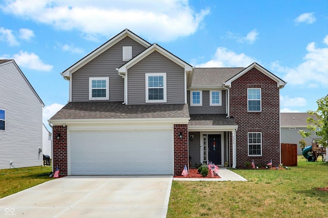 view of front of house with a garage and a front lawn