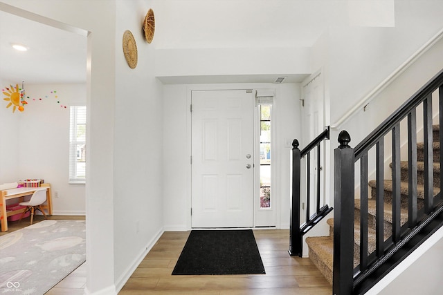 entryway with wood-type flooring