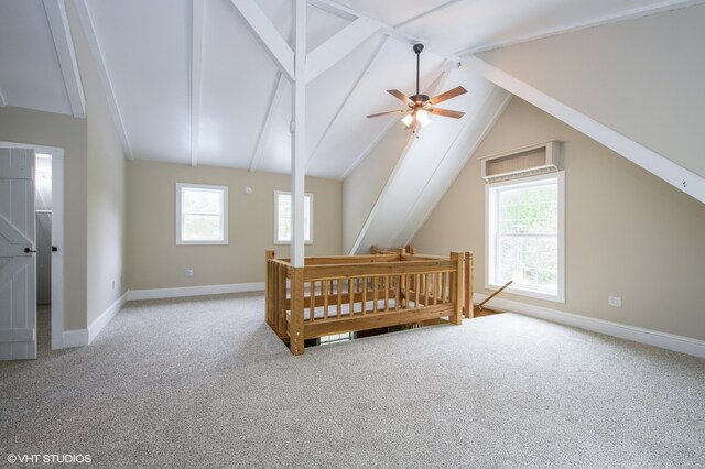 bedroom with carpet and vaulted ceiling with beams