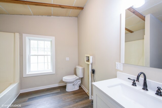 full bathroom with lofted ceiling with beams, vanity, toilet, and hardwood / wood-style floors