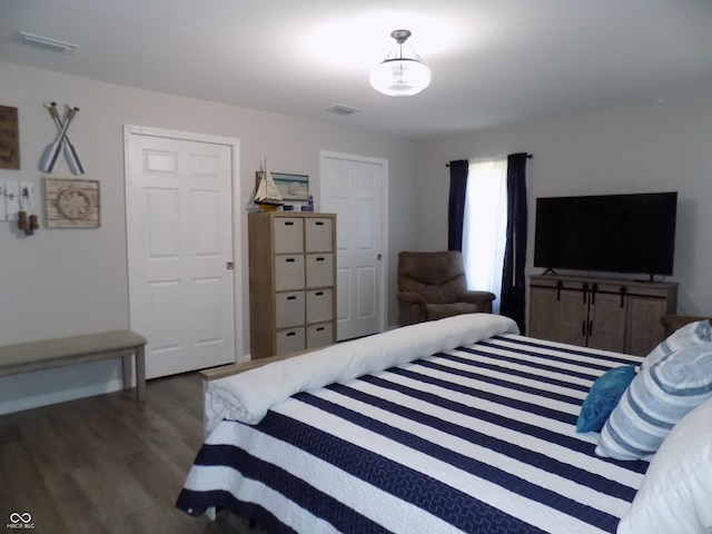 bedroom featuring dark hardwood / wood-style flooring