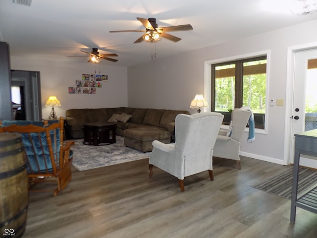 living room featuring hardwood / wood-style flooring and ceiling fan