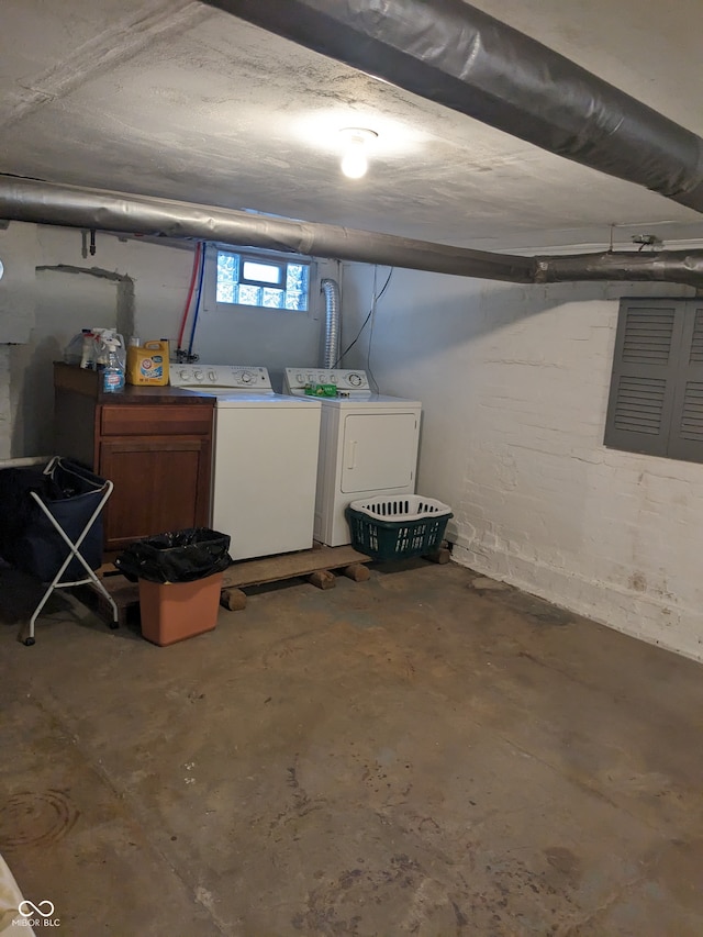 basement with washing machine and clothes dryer