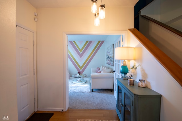 hallway with carpet floors