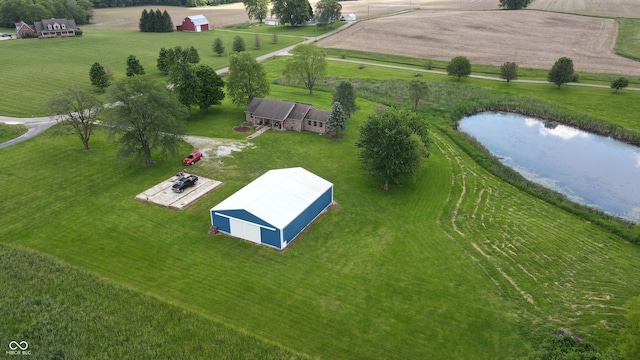 birds eye view of property with a rural view and a water view