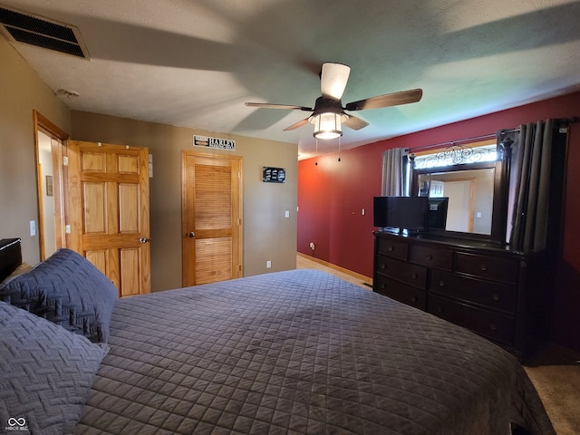 carpeted bedroom with ceiling fan