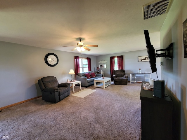 living room featuring ceiling fan and carpet flooring