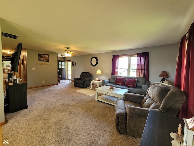 living room with ceiling fan and carpet flooring