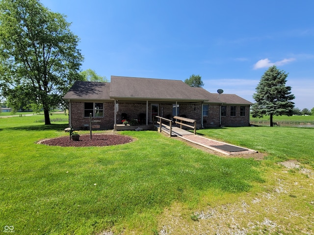 view of front of home with a front yard