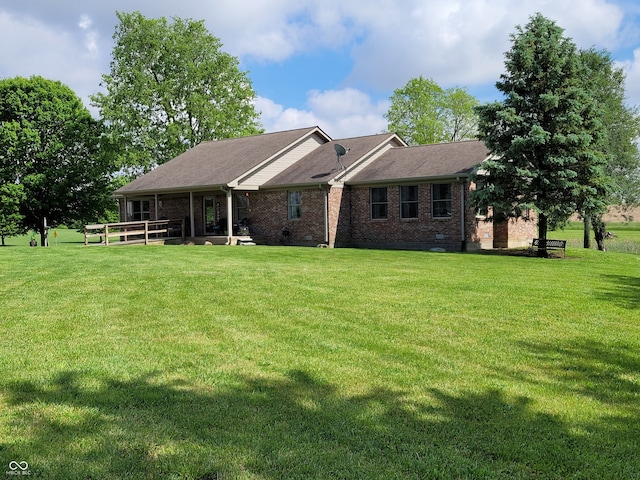 ranch-style home featuring a front yard