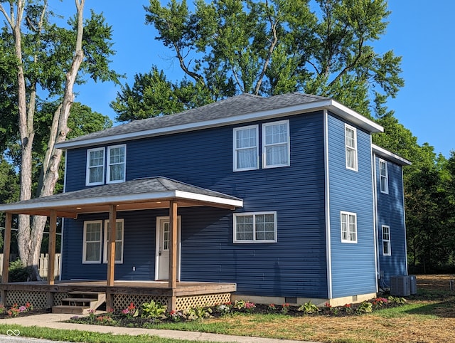 view of front of house with central AC unit and a porch