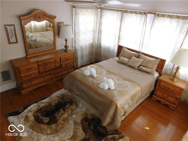 bedroom featuring hardwood / wood-style flooring and ceiling fan