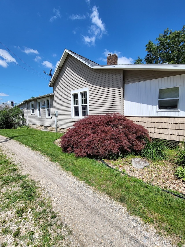 715 5th St, Covington, IN 47932 - view of side of home featuring a chimney