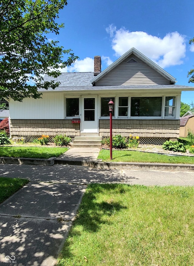 715 5th St, Covington, IN 47932 - view of front of house featuring a chimney and a porch