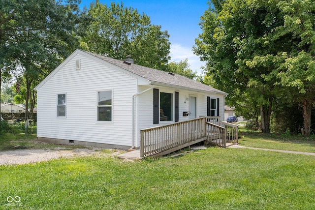 view of front of home featuring crawl space, a wooden deck, roof with shingles, and a front lawn