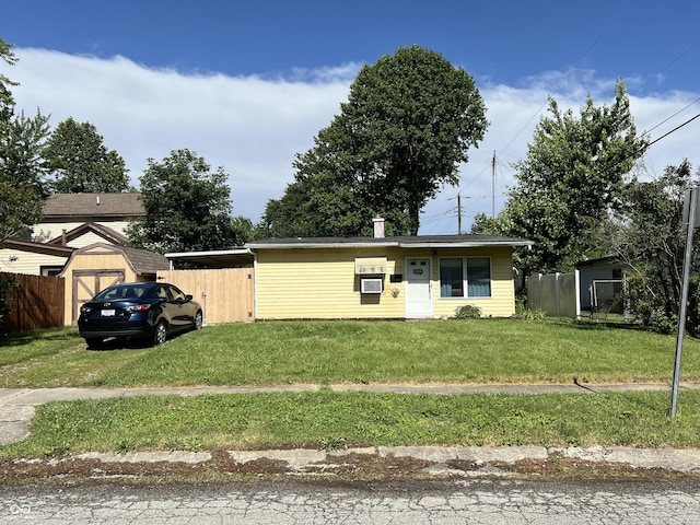 view of front of home with cooling unit and a front lawn