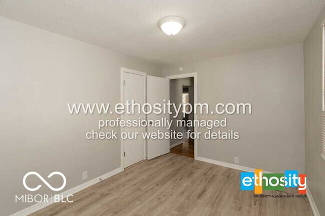 unfurnished bedroom featuring wood-type flooring