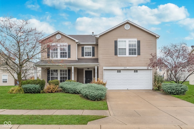 traditional-style house featuring a front lawn, driveway, and an attached garage