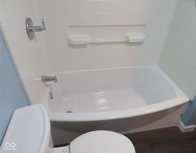 bathroom featuring hardwood / wood-style flooring and toilet