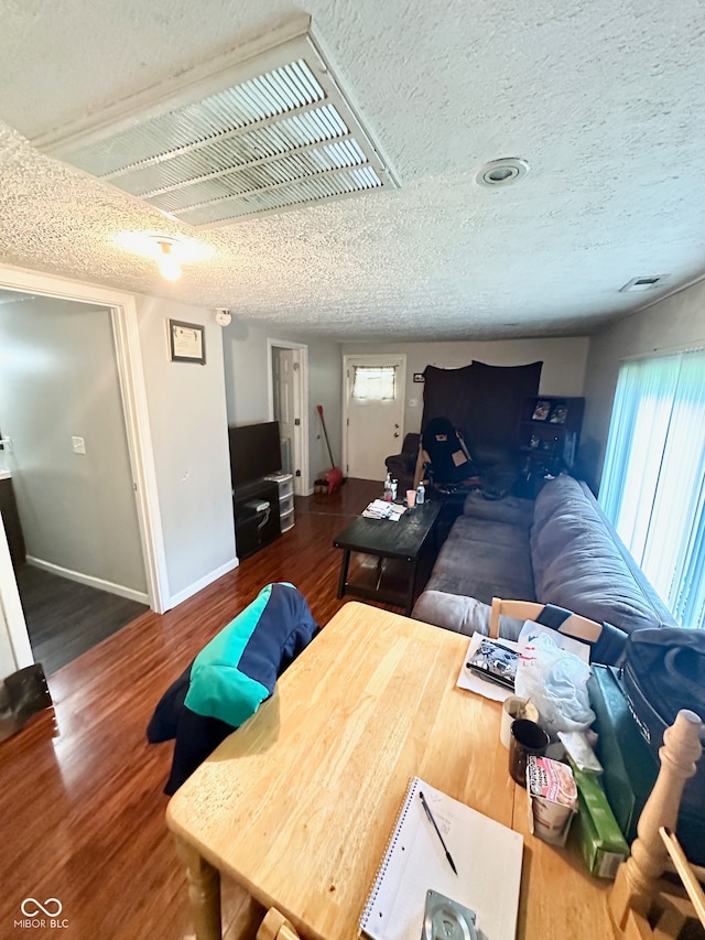 interior space with hardwood / wood-style floors and a textured ceiling