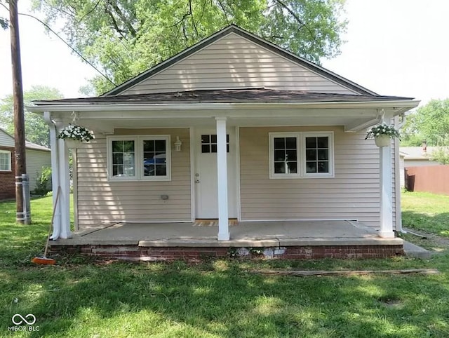 bungalow-style house featuring a front yard and a porch