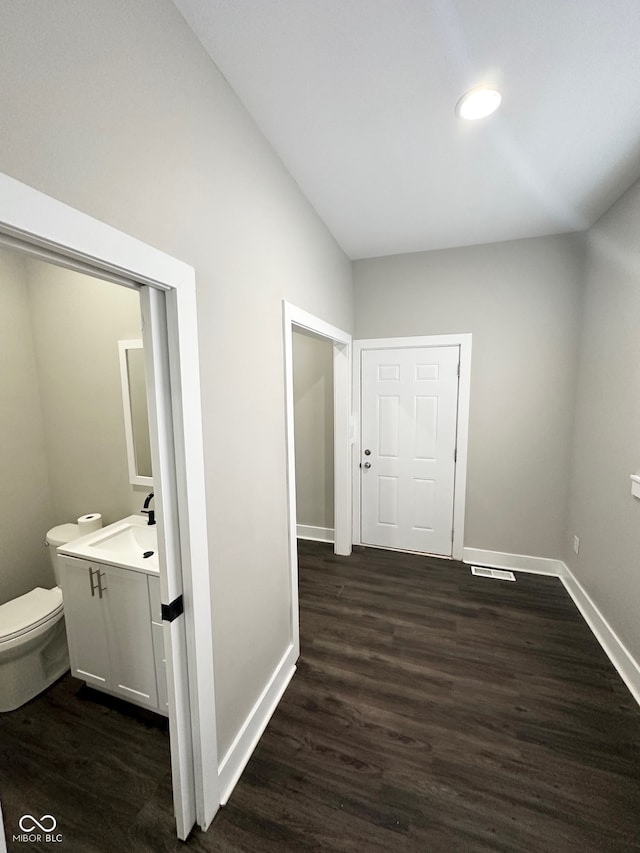 hall with sink and dark hardwood / wood-style flooring