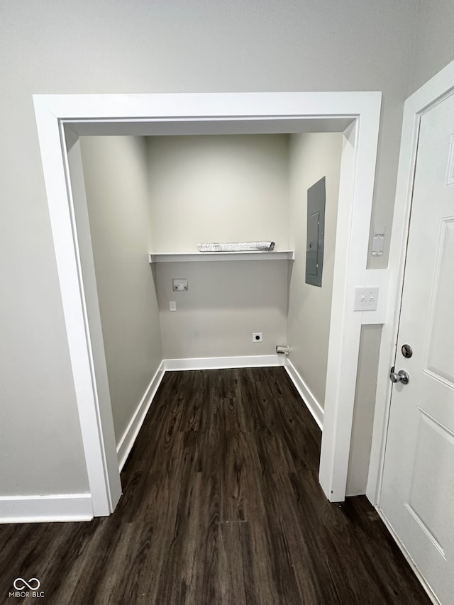 clothes washing area with dark hardwood / wood-style flooring and washer hookup