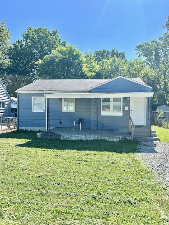 3521 N Riley Ave, Indianapolis, IN 46218 - view of front facade featuring a front yard, fence, entry steps, and a patio