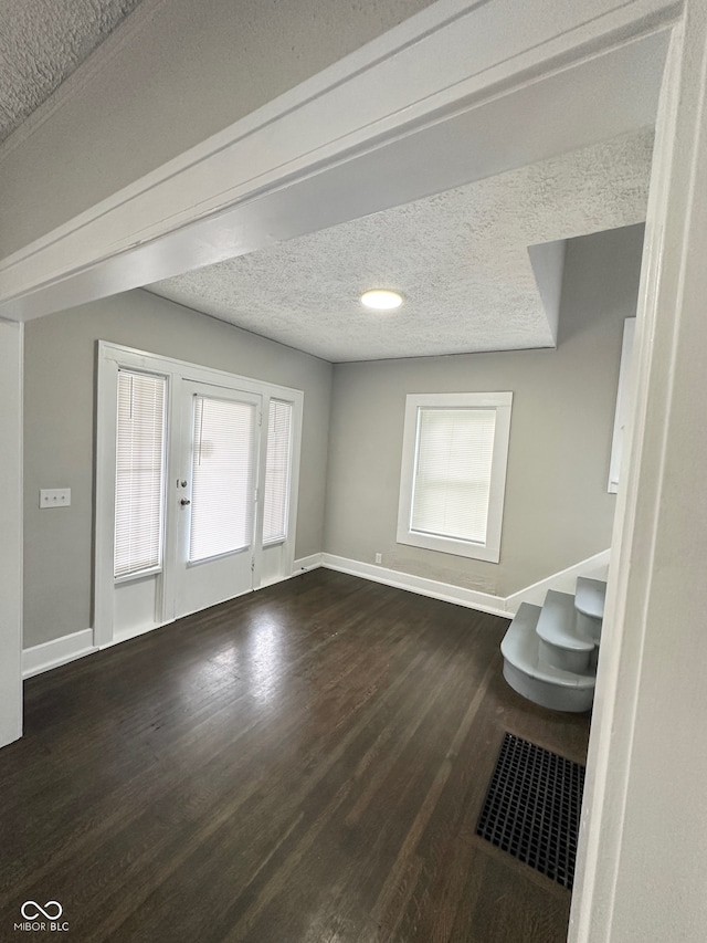 bathroom featuring a textured ceiling and hardwood / wood-style flooring