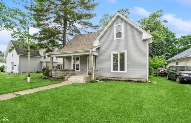 view of front of home featuring a porch and a front lawn