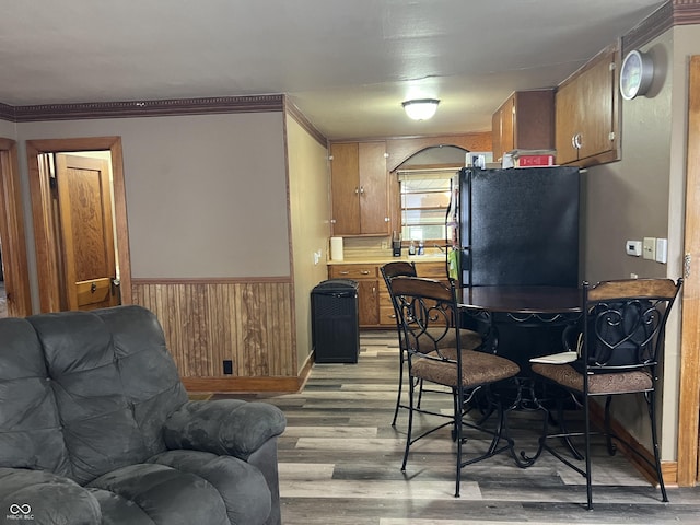 interior space featuring light hardwood / wood-style flooring and wood walls