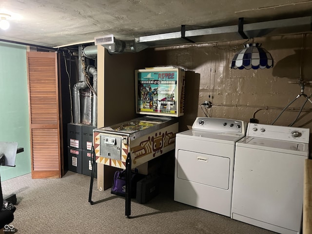 washroom featuring washer and dryer