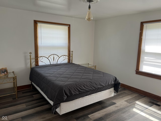 bedroom featuring dark wood-type flooring