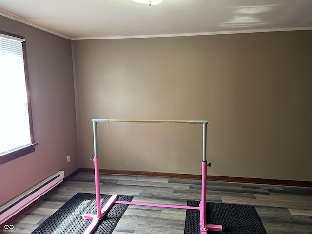 workout area with crown molding, a baseboard heating unit, and dark hardwood / wood-style floors