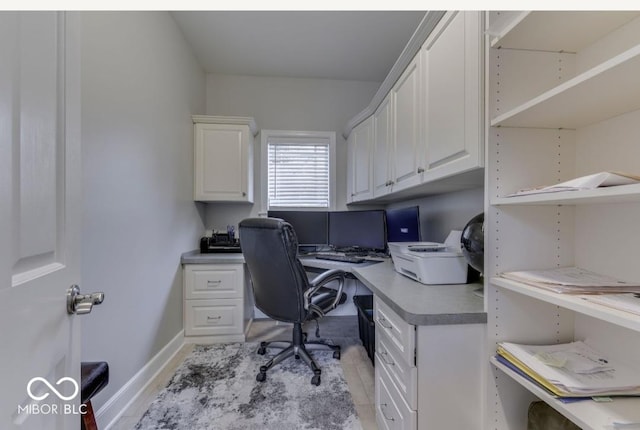 office area with light tile patterned floors