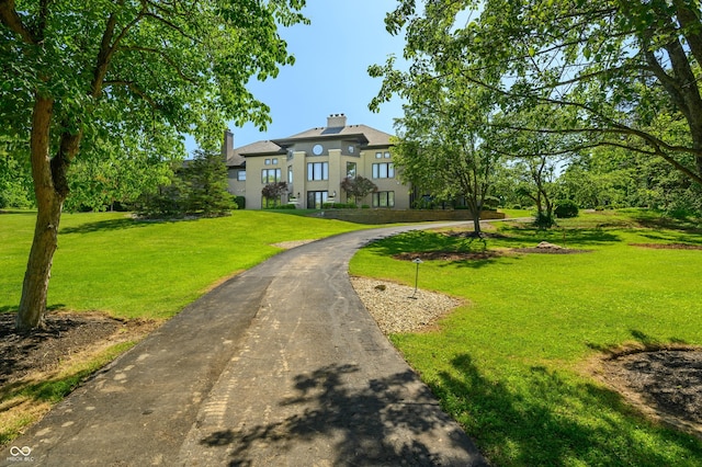 view of front of home with a front lawn