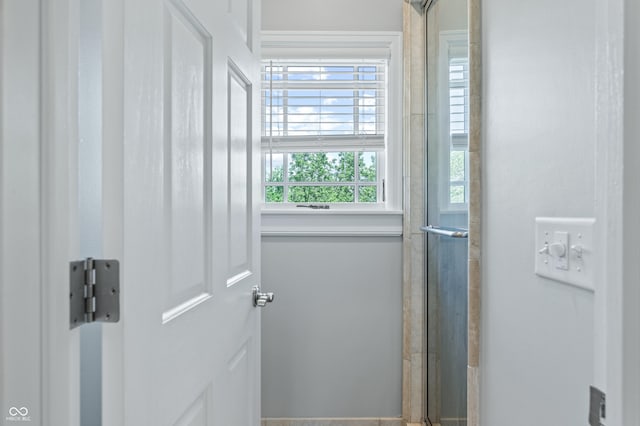 bathroom featuring an enclosed shower