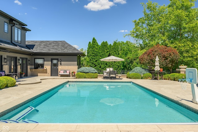 view of swimming pool featuring a patio area