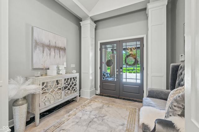 foyer with ornate columns and french doors