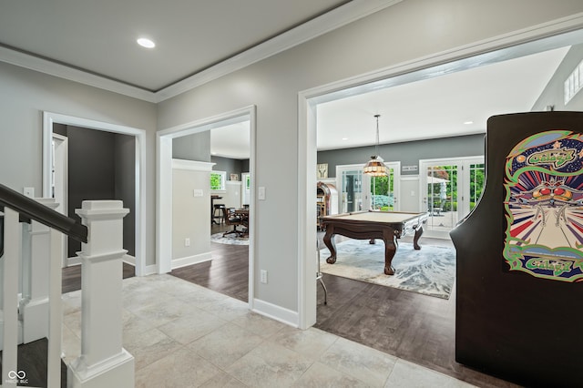 interior space with french doors, light hardwood / wood-style floors, crown molding, and pool table