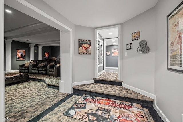 interior space with carpet floors and ornate columns