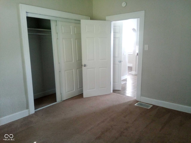 unfurnished bedroom with a closet