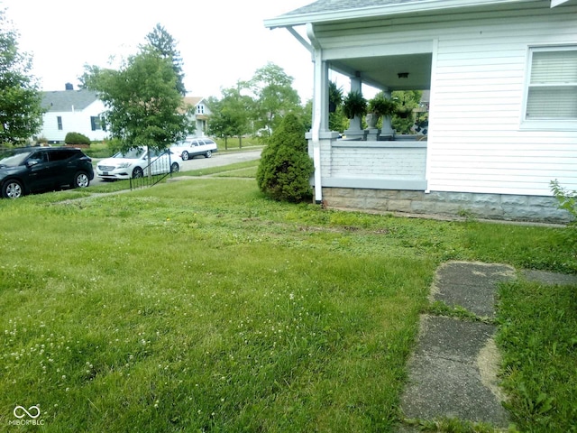 view of yard with covered porch