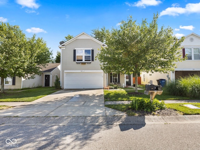 view of front of house with a front yard and a garage