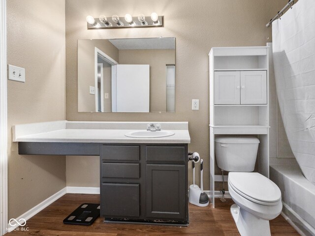 full bathroom with wood-type flooring, vanity, and toilet