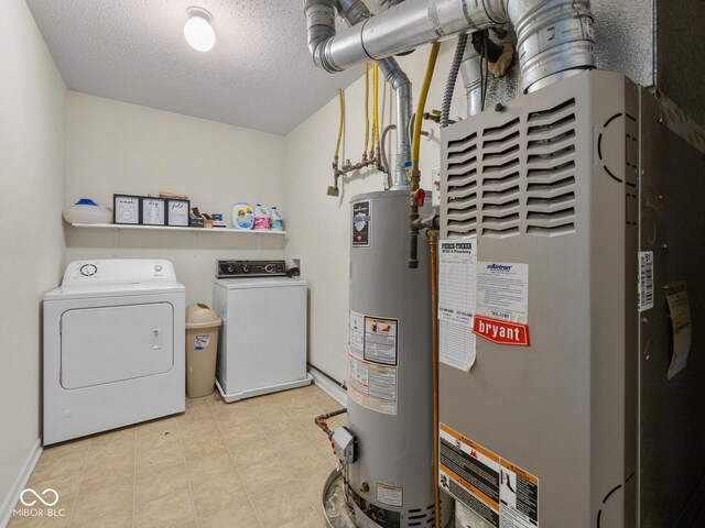 clothes washing area featuring a textured ceiling, separate washer and dryer, heating unit, and gas water heater