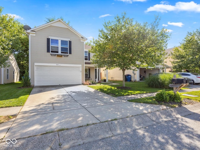 view of front of home featuring a front yard and a garage